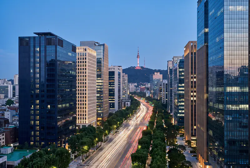 Seoul business district at dusk with N Seoul Tower in the distance
